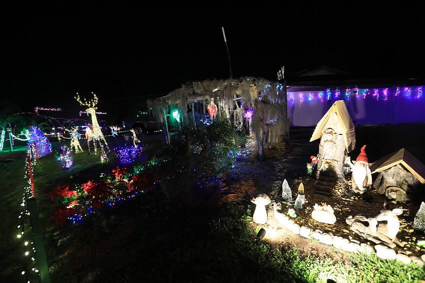 5077 Bunyan Street  Most people marvel at the joyful lettering at the front of the house, but take a minute to admire the Nativity scene.