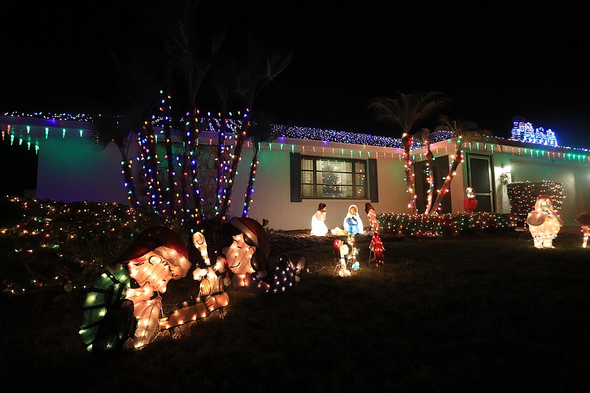 1929 Oak View Drive has a good mix of varied Christmas lights on the top of the house with a flashing Santa and reindeer design.