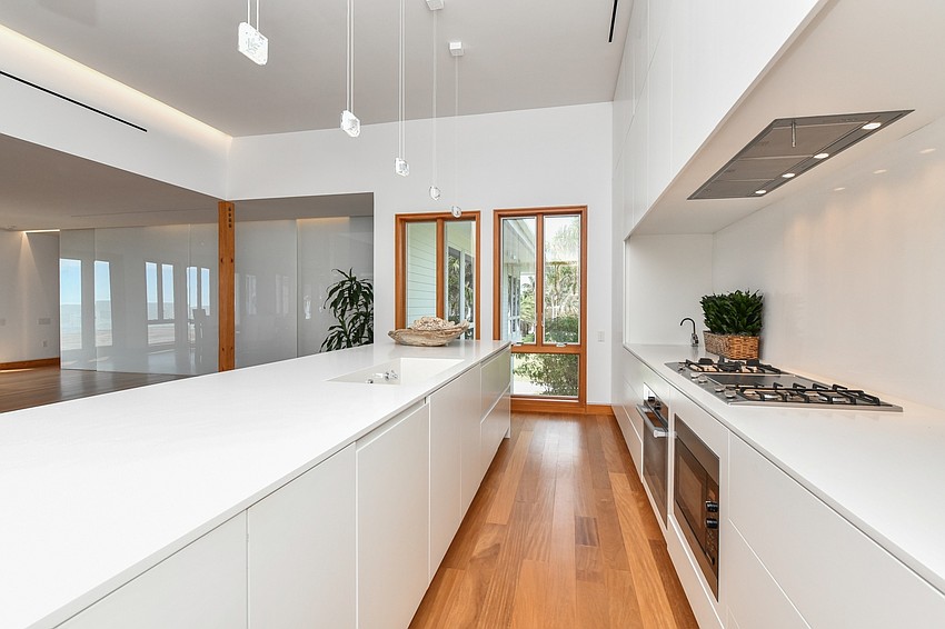 The kitchen is done in white.