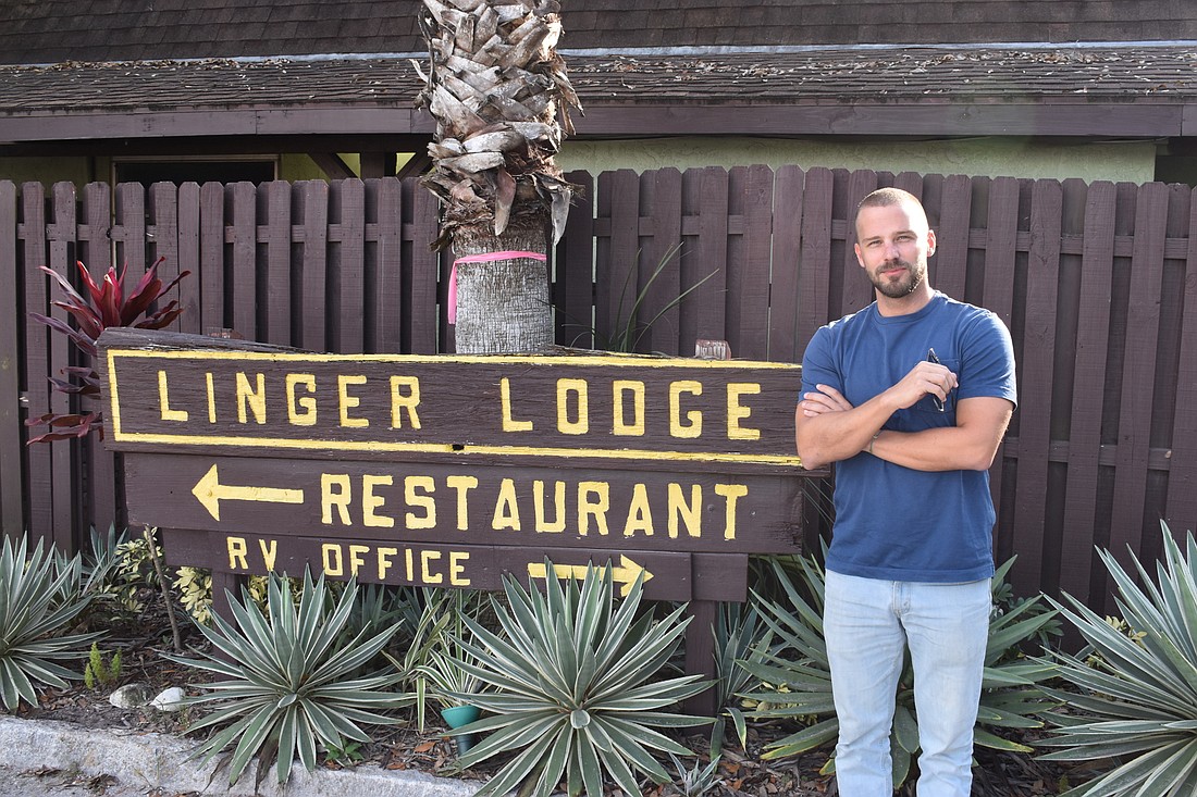 Phillip Hartl stands outside of the entrance to the Linger Lodge restaurant on Dec. 13. His family purchased the property in 2016 and have overseen an extensive remodel of the property over the last year and a half.