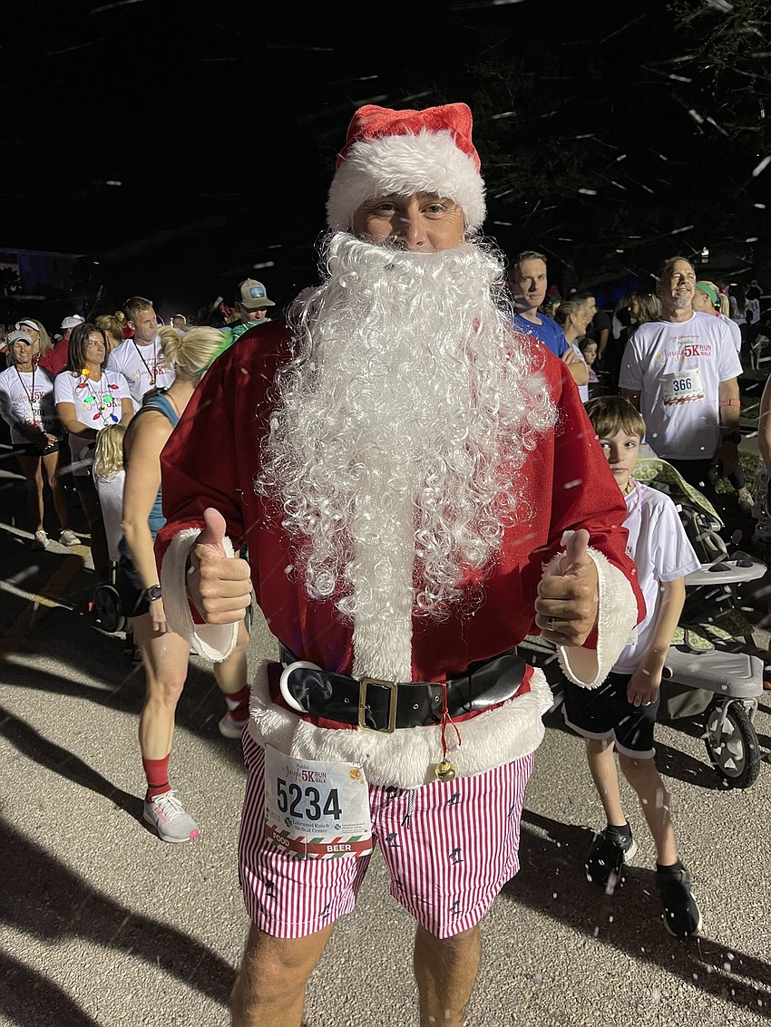 Jared Autrie of Lakewood Ranch gets ready to run the Jingle Run in his Santa suit – with shorts instead of pants.