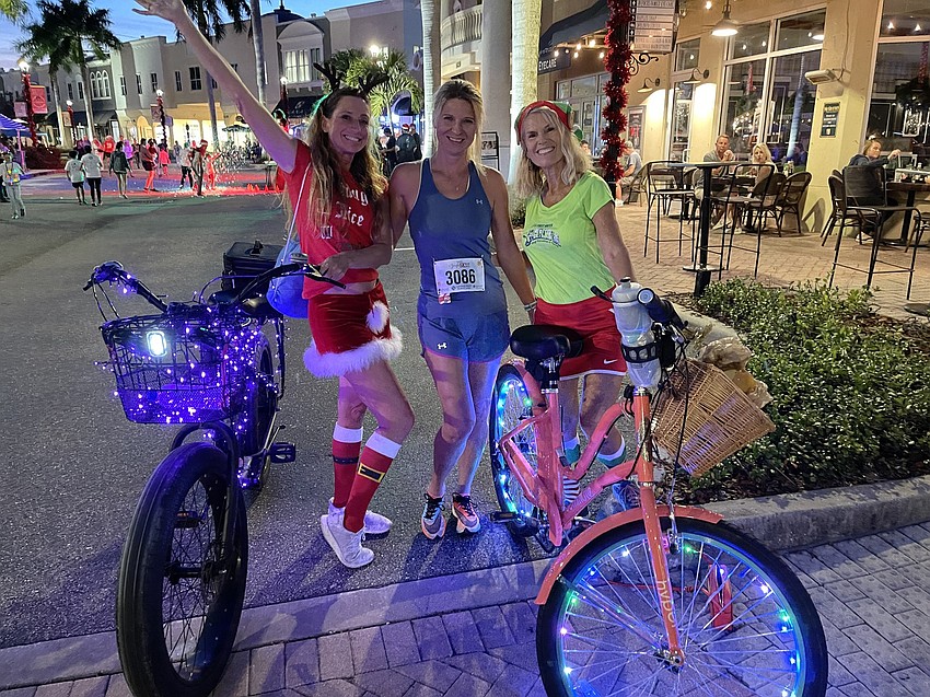 April Shereda and Ingrid Girsdlova, both of Sarasota, join Lakewood Ranch's Karen Mann for some fun on Main Street prior to the Jingle Run.