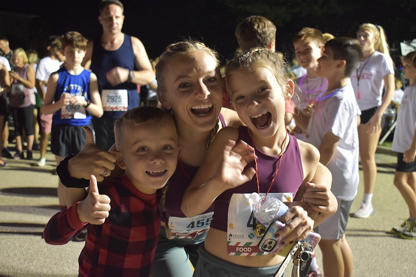 Broncs, Mackenzie and Jaxie McKee share some laughs before the Jingle Run.