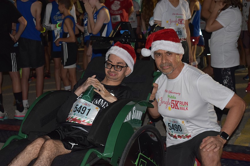 Lakewood Ranch's Sammy and Rickardo Lomas stand at the starting line as they get set to take part in the Jingle Run.