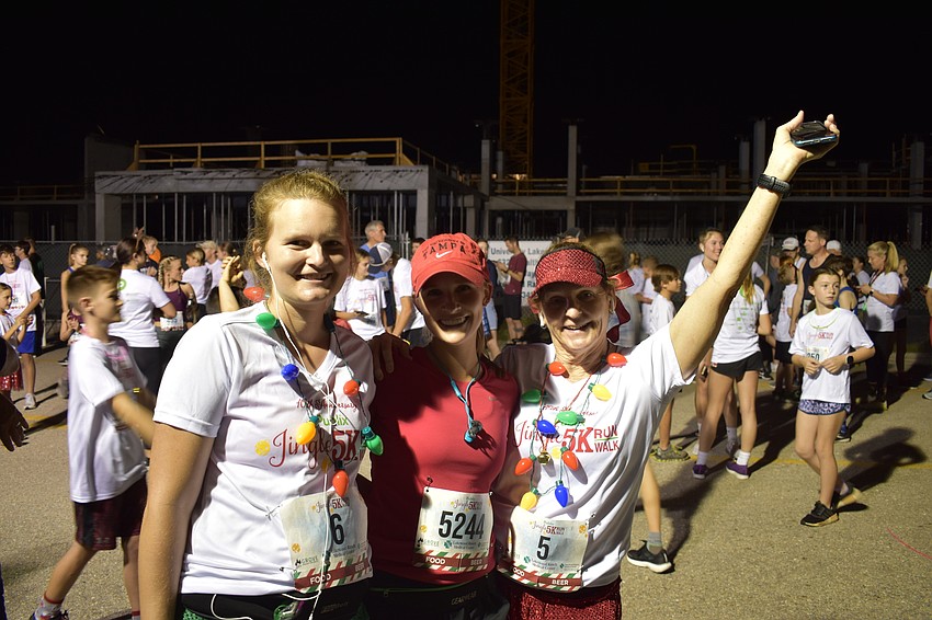 Emily Gessner, Taylor Young and Kate Gessner, all of Lakewood Ranch, get set for the Jingle Run.