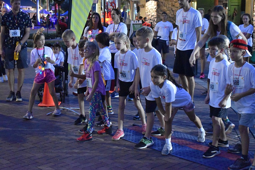 Kids are ready to fire off the starting line for a Santa Dash.