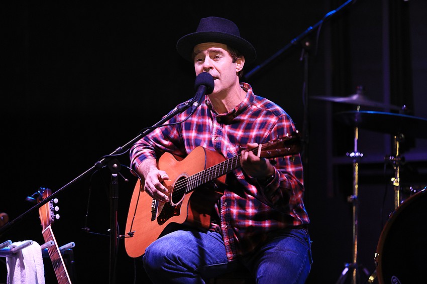 Mike Tozier plays music for an attentive audience.