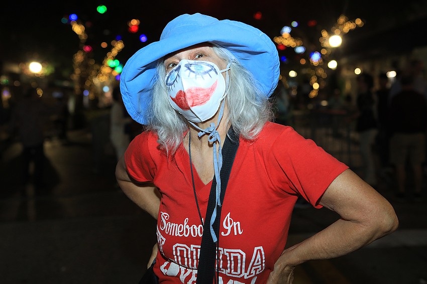 Jane Strauss wears a cheerful mask.