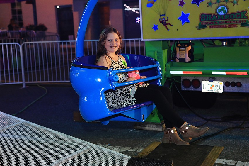 Olive Schomburg finishes a carnival ride.