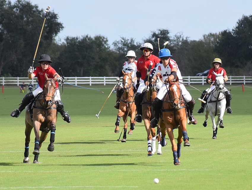 Francisco Llosa of Florado/Sharp Printing (center) breaks in front of the field to put a shot on goal. His team won the title match 10-8 over Hillcroft/Hawkwood.