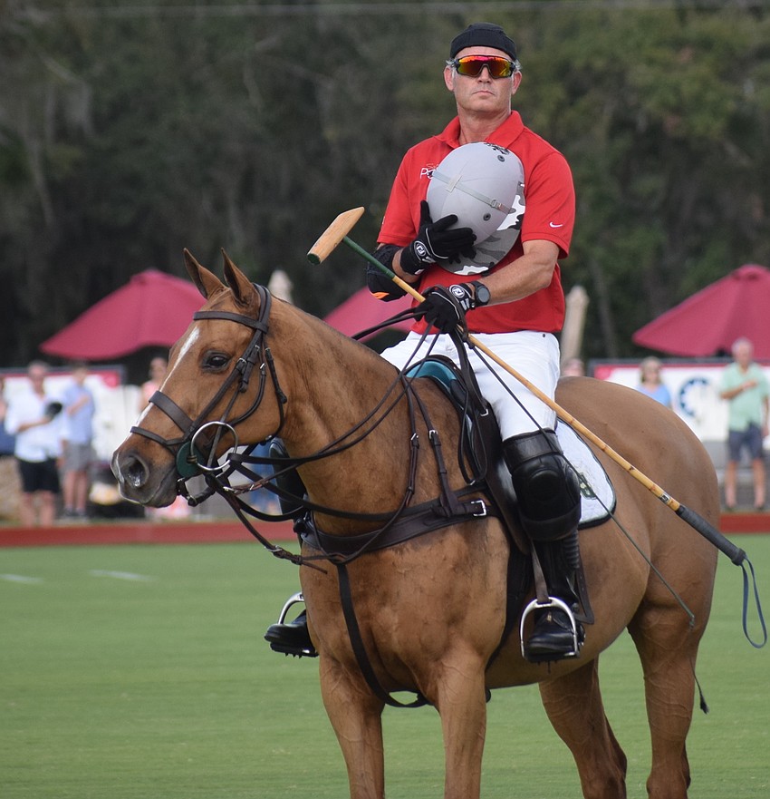 James Miller of the Hillcroft/Hawkwood team stands at attention during the National Anthem before the title match.