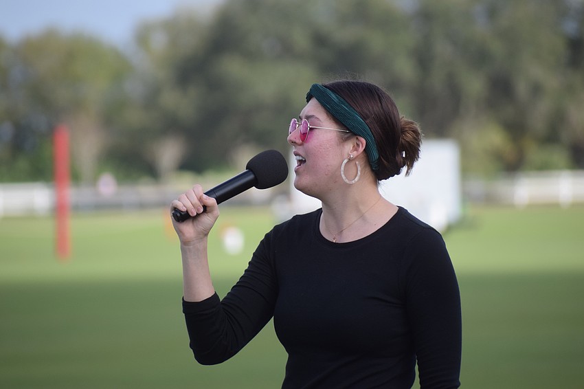 Music Compound's Jasleen Kaur sang the National Anthem before the match.