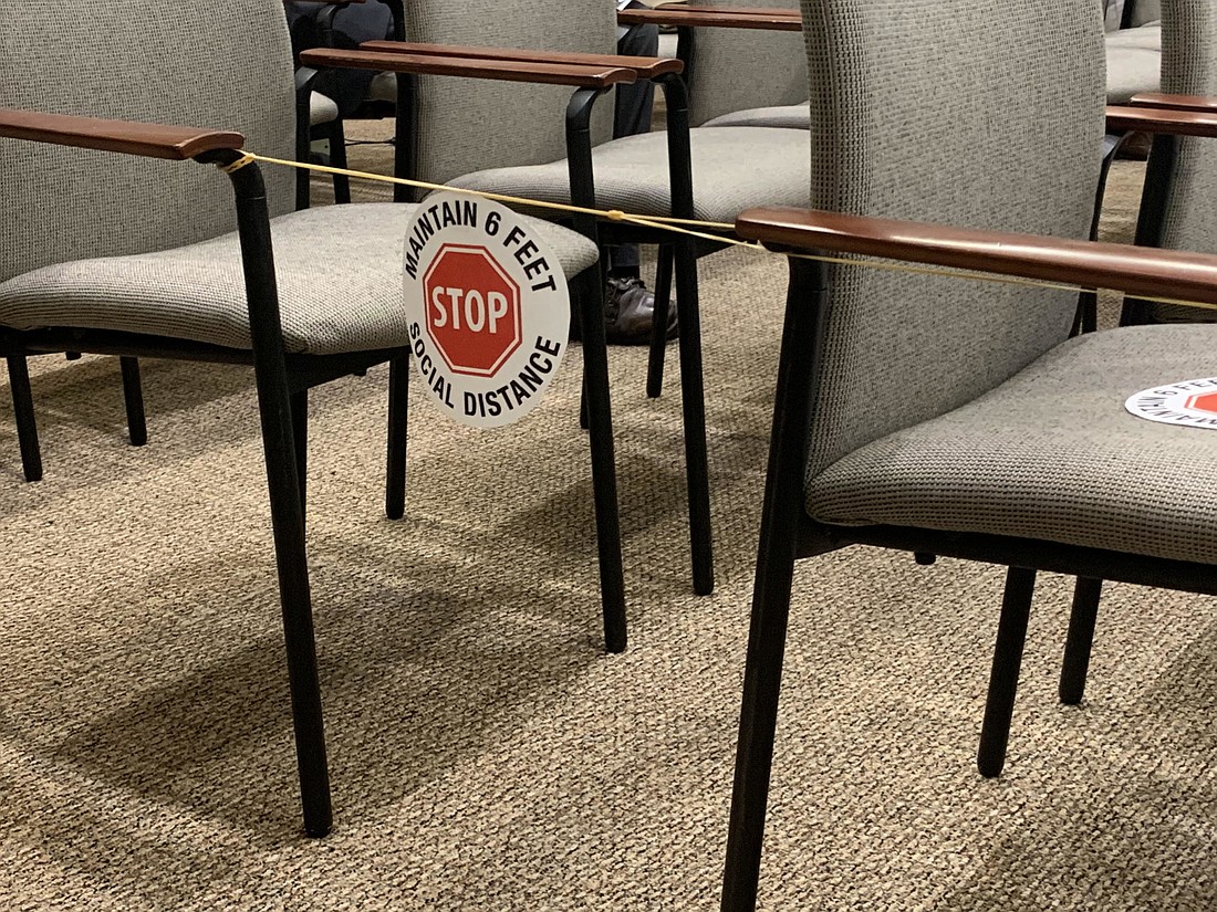 Inside the Town Commission Chambers, the town has used signage to ensure members of the public are maintaining at least 6 feet of social distancing. File photo