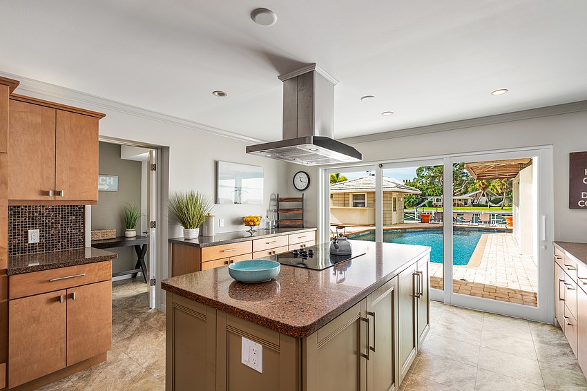 The open floor plan overlooks the pool.
