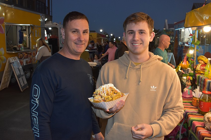 Chris and Austin DeCosta, of Lakewood Ranch, get set to tackle a huge order of nachos.