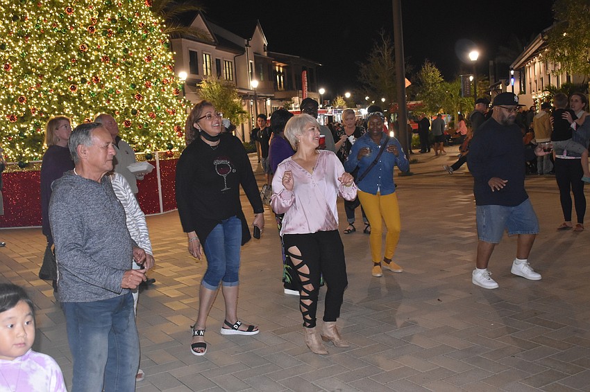 Ranch Nite Wednesday attendees dance to the music of Sarasota-based Jah Movement.