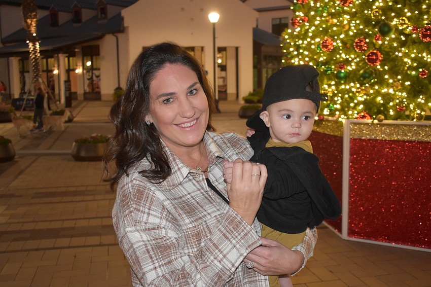 Dana Arcos, of Lakewood Ranch, enjoys a night at Waterside Place with her 6-month-old son, Sawyer.