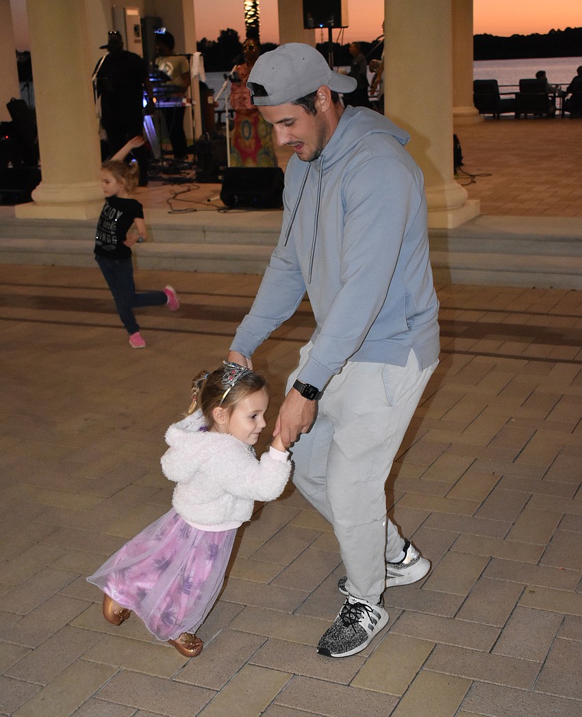 Josh Burch, of Lakewood Ranch, takes a spin on the dance floor with his 2-year-old daughter, Collins.