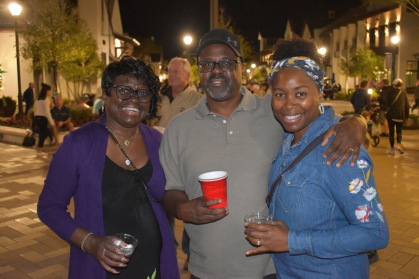Lakewood Ranch's Louise Grigg, Wade Thomas and Tunisa Thomas take in the music and sights of Ranch Nite Wednesday.