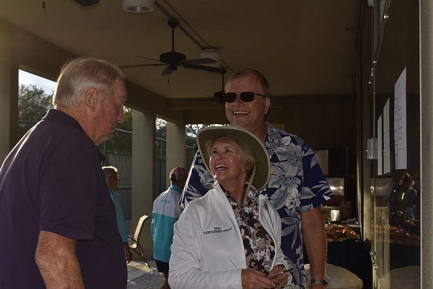 Cathy and Paul Tomass (right) compare play times with Trevor Gillott