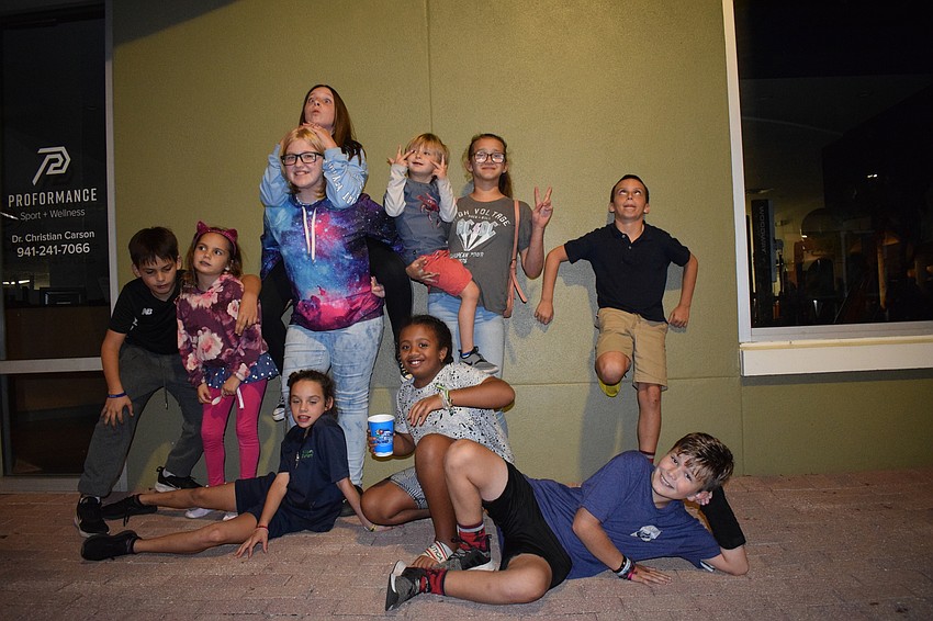Ethan Agnel, Emma Angel, Camryn Duley, Tesa Stesney, Jada Miller, Taylor Joiner, Benjamin Angel, Isabella McCall, Caleb Johnson and Channing Stesney have fun during Main Street at Lakewood Ranch.