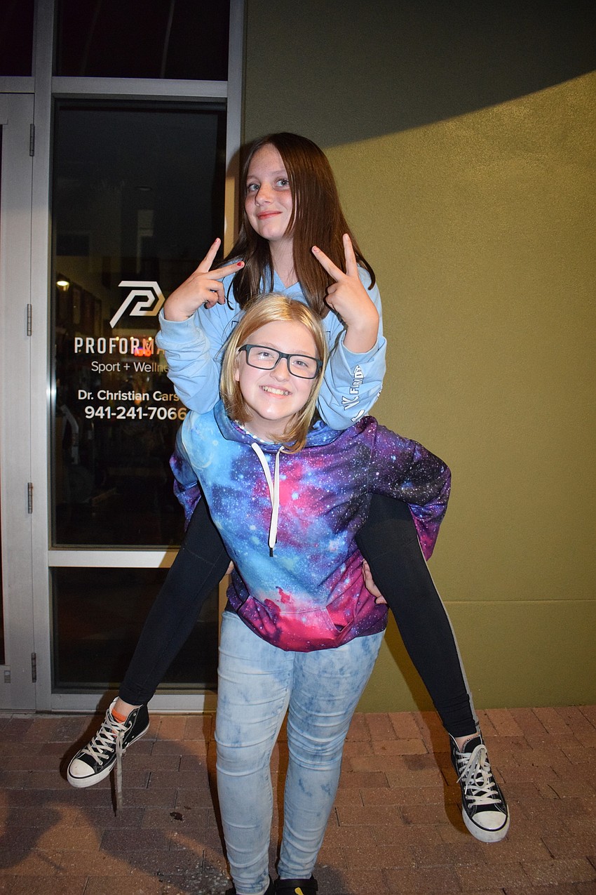 Lakewood Ranch's Tesa Stesney jumps on top of Lakewood Ranch's Camryn Duley.