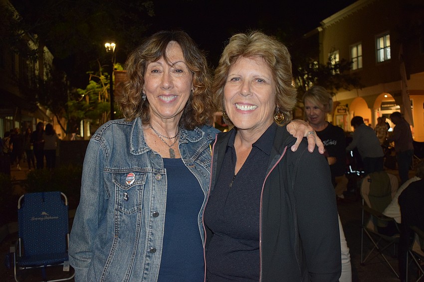 Lakewood Ranch's Rochelle Honig and Judy Anastasia enjoy being outside on a cool night listening to live music.