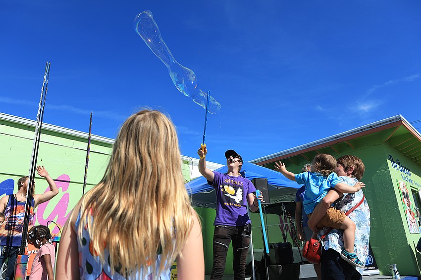 Blaise Ryndes dazzles the crowd with bubbles.