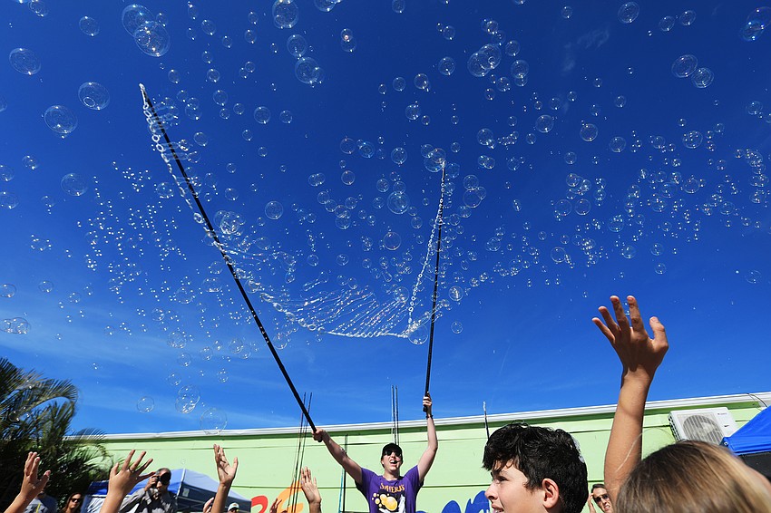 Blaise Ryndes dazzles the crowd with bubbles.