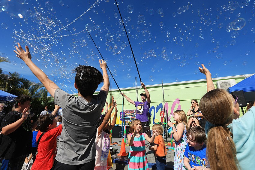 Blaise Ryndes dazzles the crowd with bubbles.