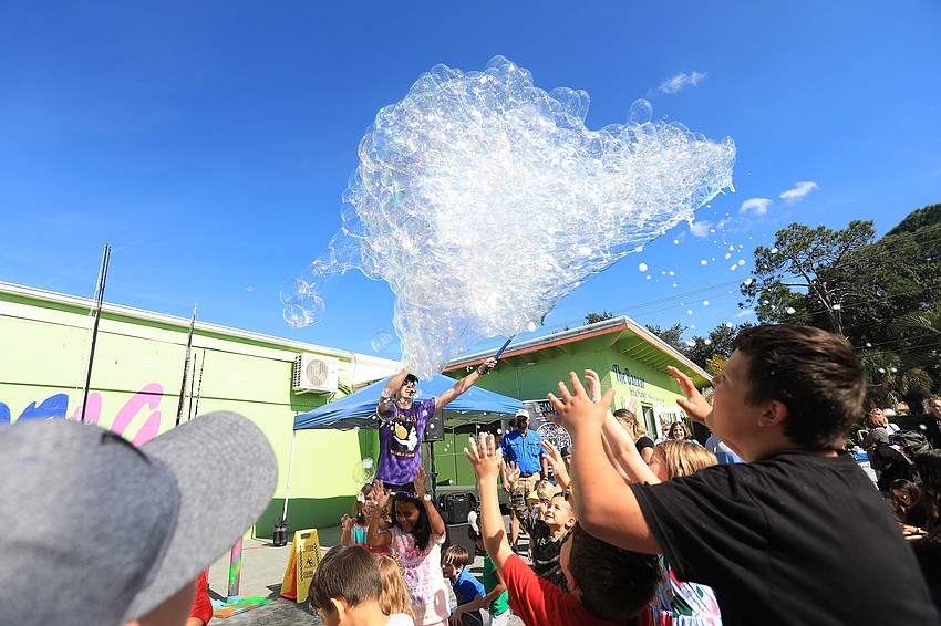 Blaise Ryndes dazzles the crowd with bubbles.
