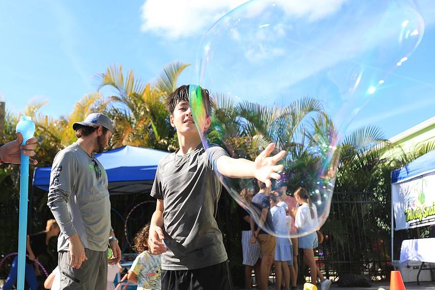 Adam Lesser admires his work.