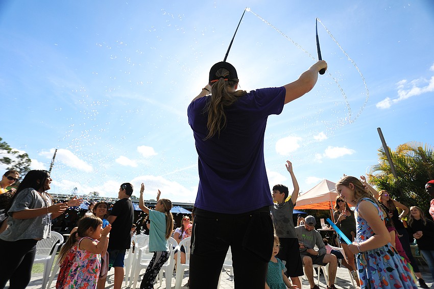 Blaise Ryndes dazzles the crowd with bubbles.