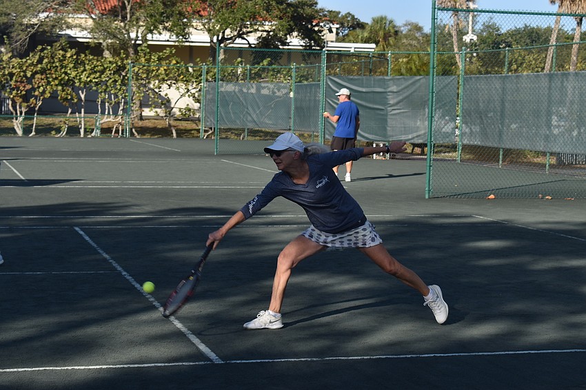 Peggy Lavellee goes low to return a let in the Division 3 round robin.