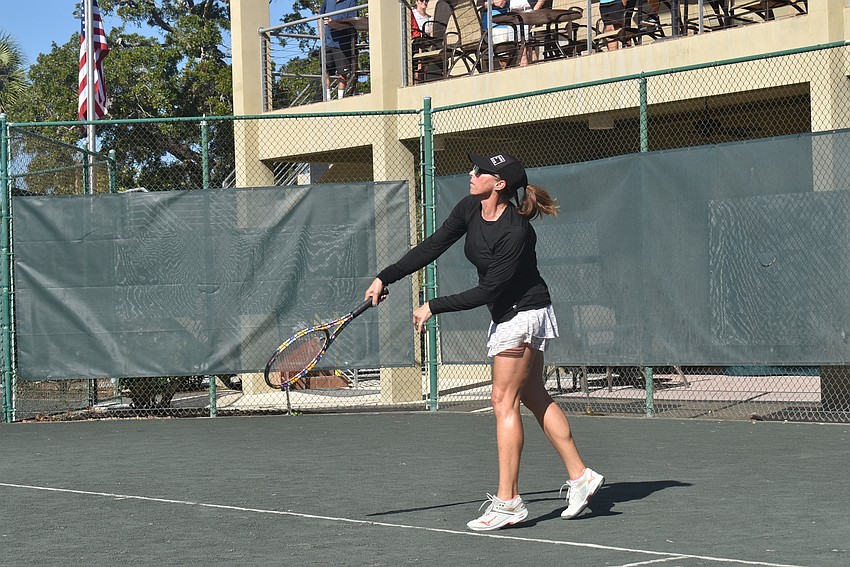 Rebecca Gibson smashes a point during the Division 1 final.