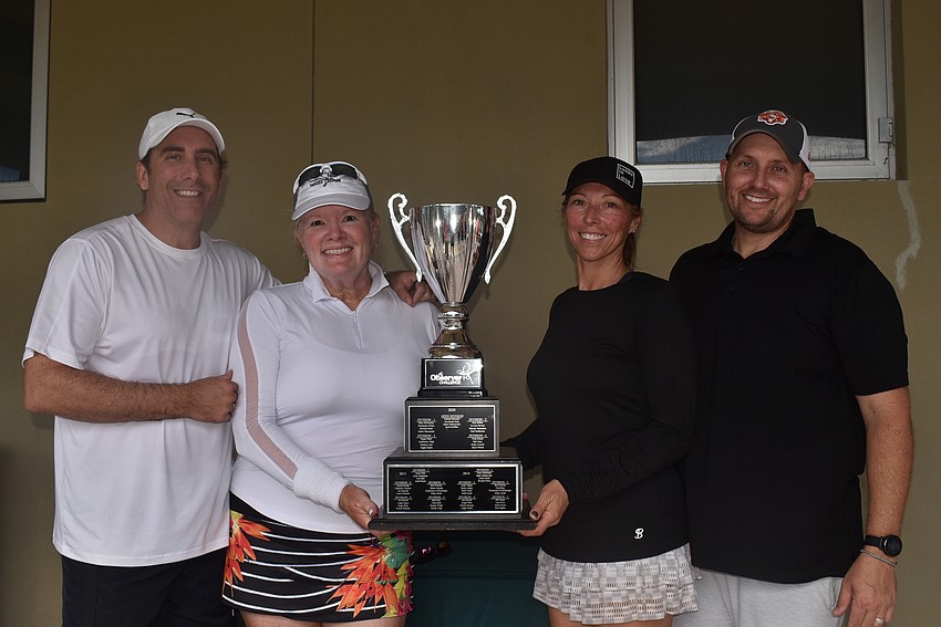 Division 1 champions Marc Pommainville, Stacey Allerton, Rebecca Gibson and Randy Gibson