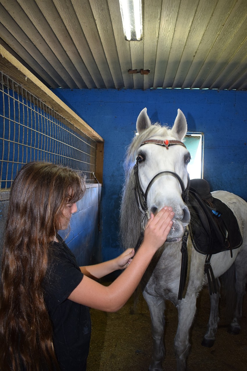 Barn work isn't Sydney McCullough's favorite part of her tasks on the ranch, but she has had to 
