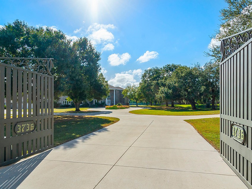In addition to the main house, there is a guest house and a freestanding garage/game room.