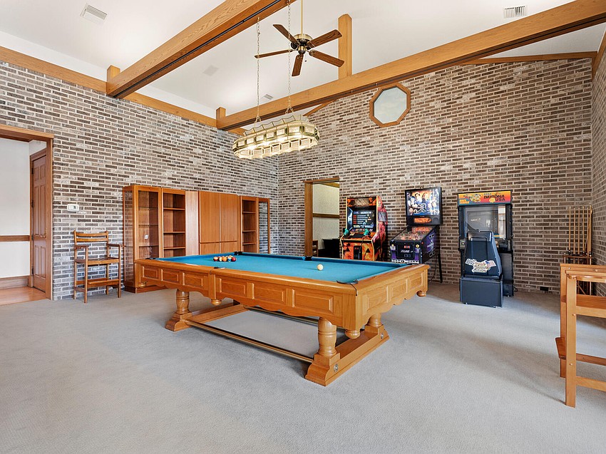 The freestanding garage is used as a game room.