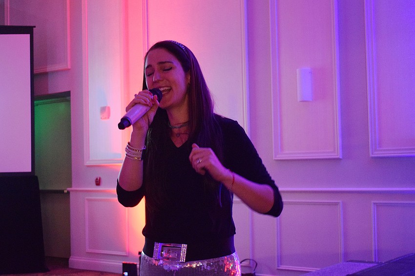 Simone Roitman performs during the Mega Challah Bake at the Grove.