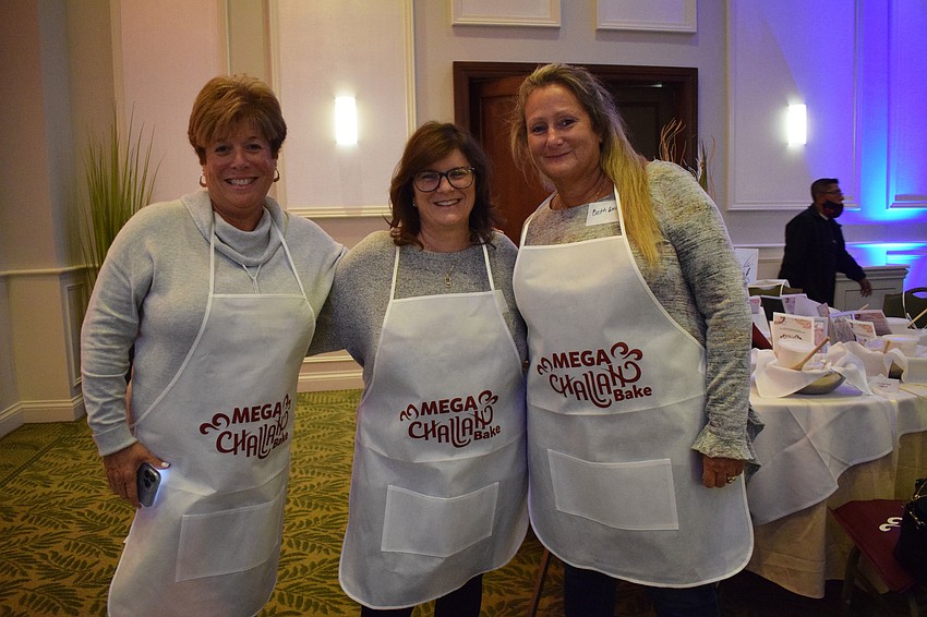 Lakewood Ranch's Lisa Shinefeld, Linda Goldberg and Beth Ann Frack prepare for the Mega Challah Bake. Goldberg has participated in the bake for the past three years while Shinefeld and Frack participate for the first time.