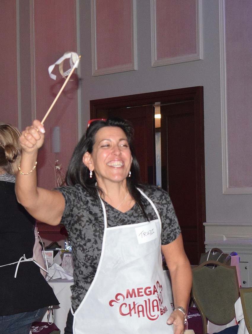 Lakewood Ranch's Trudi Krames dances with other women during the Mega Challah Bake.