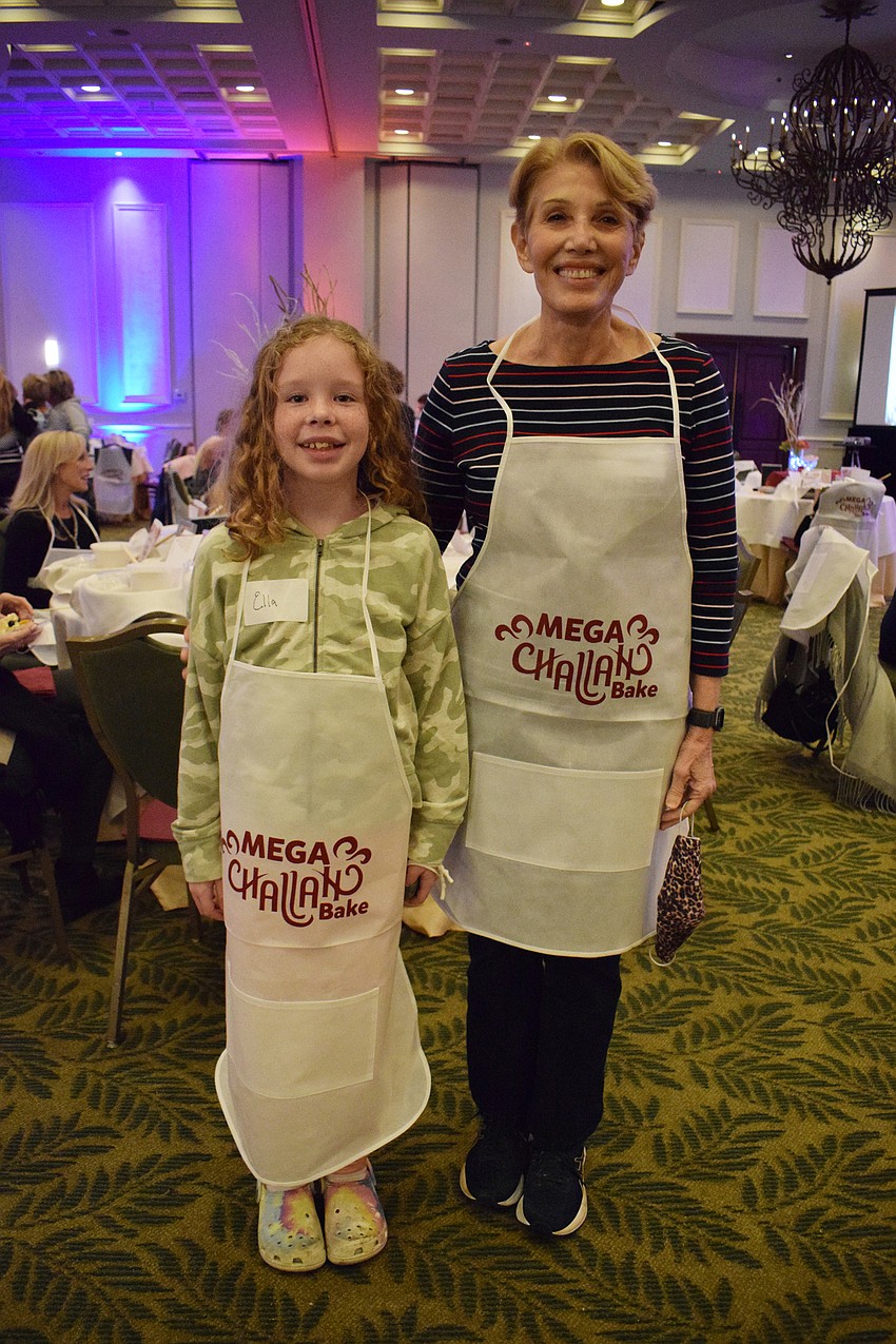 Parrish's Ella Mundt, who is 9 years old, makes challah for the first time with the help of her grandmother, Stephanie Sarnoff.