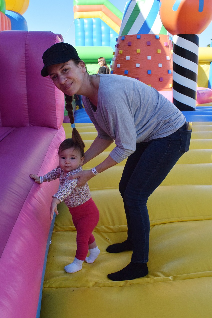 Sarasota's Sendi Todoric softly jumps with her 1-year-old daughter Mila Todoric. 