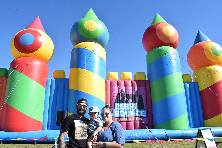 Sarasota's Stewart Bray enjoys Big Bounce America with his 19-month-old son Craig Bray and his wife Nicole Bray.