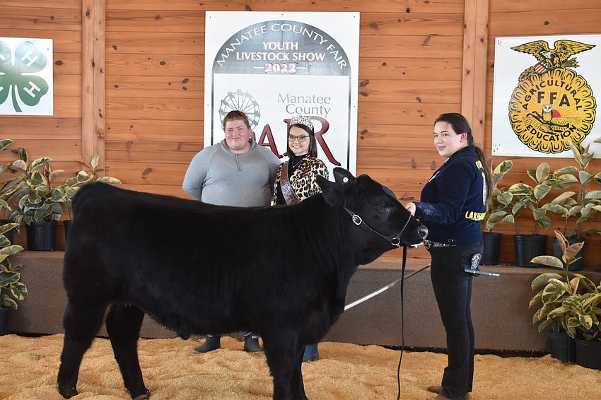Kaylee Hatwig of K&M Equestrian Services (left) was the buyer of Peso. Also pictured are Manatee County Fair Cattlemen's Sweetheart Shelbie Davis and Madeline Fields of the Lakewood Ranch High School FFA.