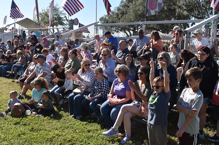 The crowd reacts to seeing pigs jump through hurdles, navigate their way around barriers and jump through hoops at the Hollywood Racing Pigs show.