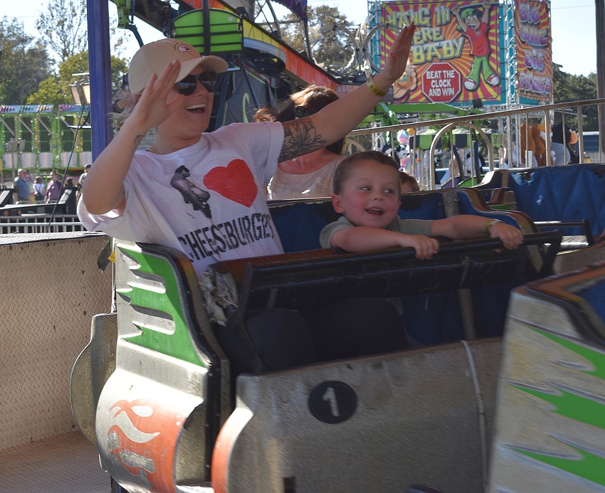 Victoria Hubbard and 4 year-old Bryson Hubbard of Bradenton enjoy a ride on the Silver Streak.