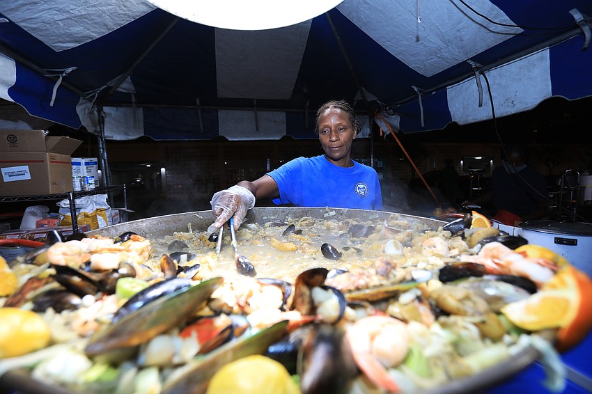 Sandy Thomas with Hammerheads cooks up food.