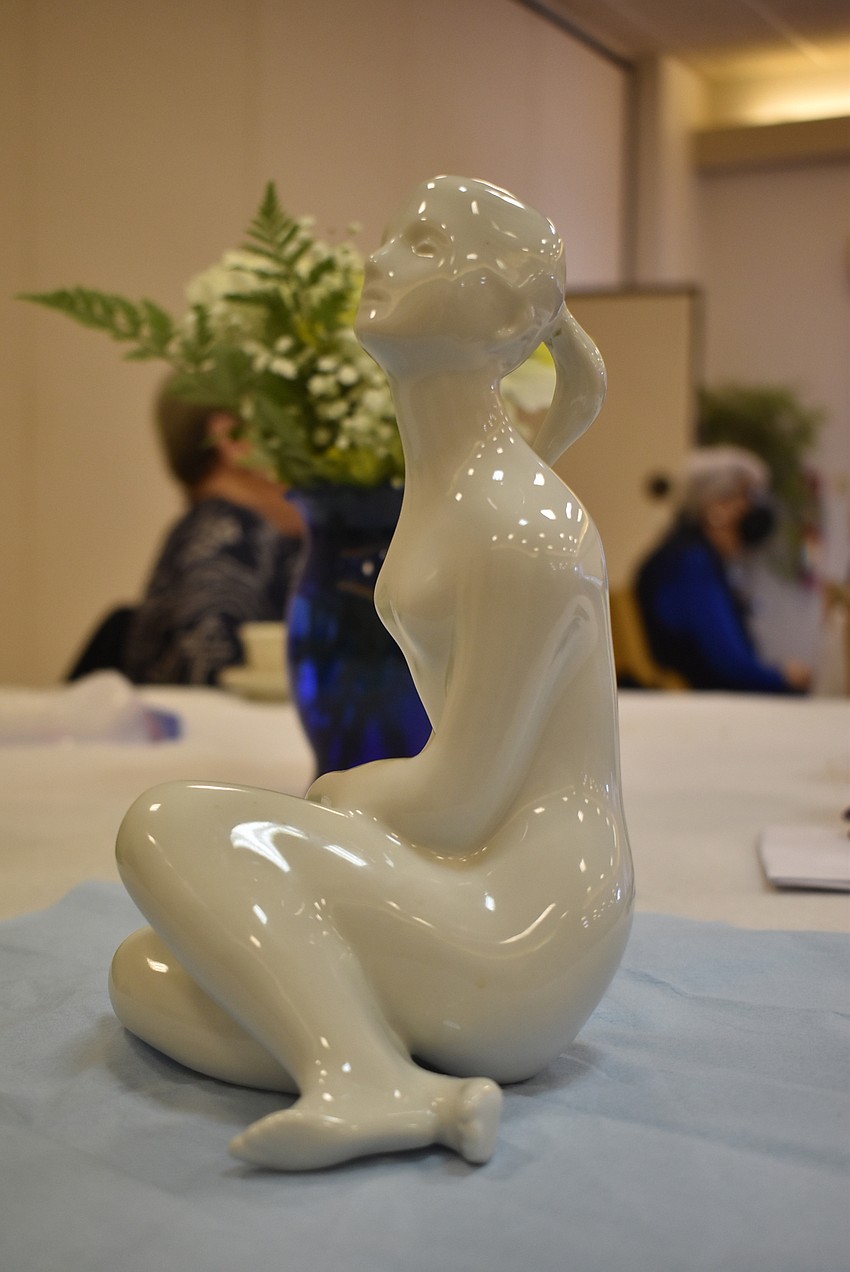 Gloria Feibus brought a porcelain figure, which turned out to be worth $250.
